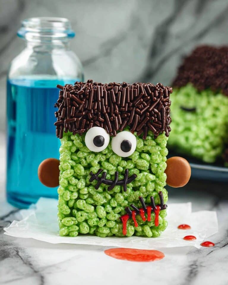 Halloween Green Frankenstein Rice Krispies Treats with Candy Eyeballs and Neck Bolts Recipe