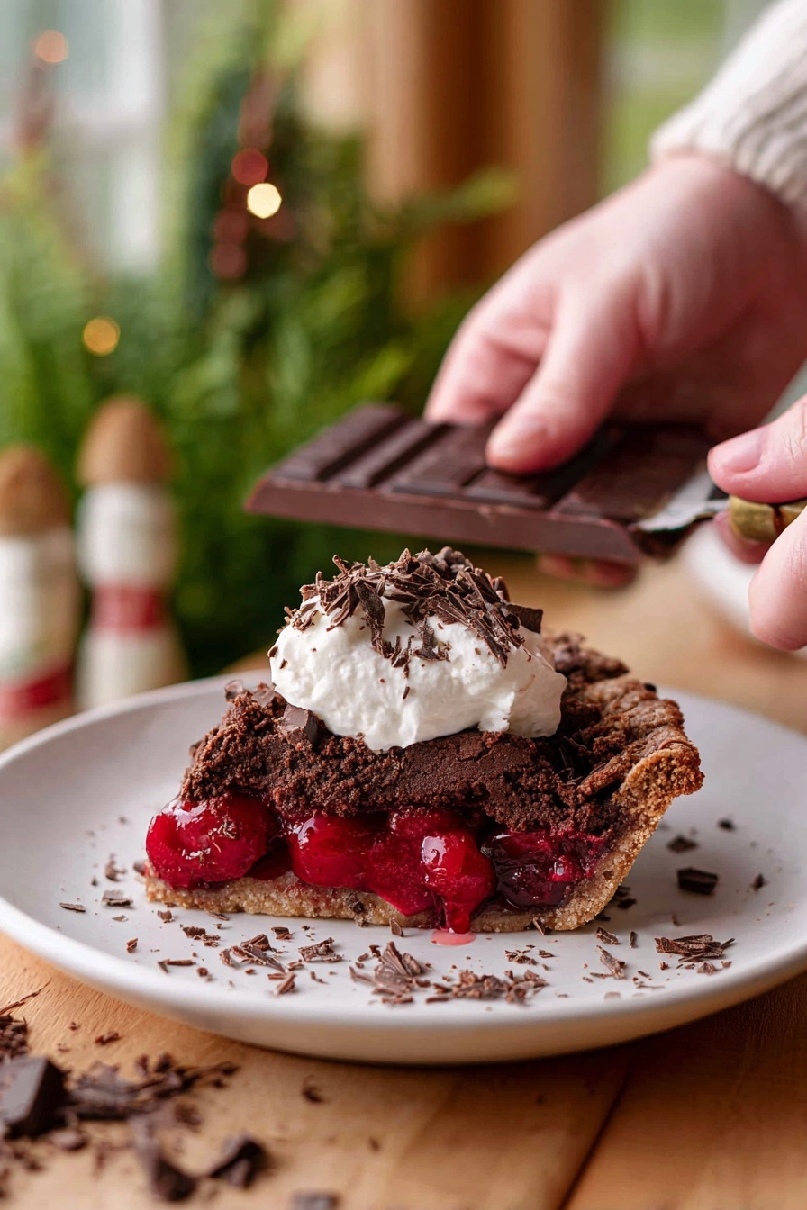 Chocolate Cherry Black Forest Pie, black forest cherry pie, chocolate cherry dessert, black forest pie with mascarpone, tart cherry chocolate pie - A slice of dark brown chocolate pie with a rough textured top layer sits on a white plate, revealing a thick, bright red cherry filling in the middle layer. On top of the pie slice, there is a dollop of white cream with small dark chocolate shavings scattered over it and around the plate. In the background, a woman’s hand is holding a dark chocolate bar and scraping chocolate shavings. The scene is set on a wooden surface with a soft focus of green plants and warm-toned decor in the background, all on a white marbled texture. photo taken with an iphone --ar 2:3 --v 7