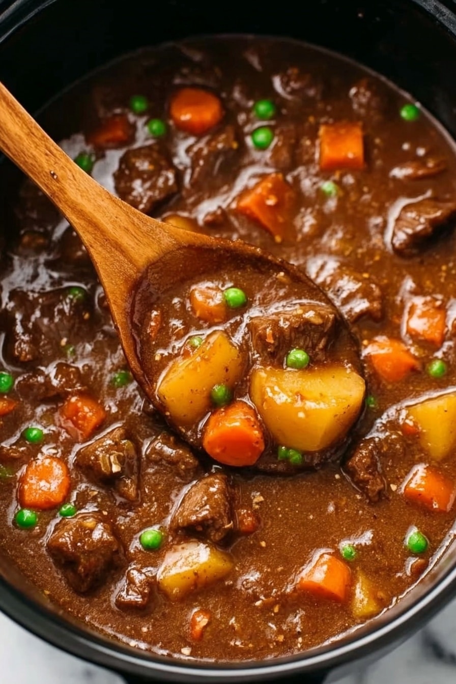 Slow Cooker Beef Stew with Red Wine and Vegetables, hearty beef stew, slow cooker beef recipes, beef and vegetable stew, red wine beef stew - The image shows a close-up of beef stew in a black pot, filled with tender-looking chunks of brown beef, bright orange carrot pieces, small green peas, and yellow baby potatoes all mixed in a thick, glossy brown gravy. In the center, a wooden spoon scoops up some of the stew, revealing the chunky vegetables and meat soaked in rich sauce. The stew surface looks smooth with a hearty, comforting texture. The background is a white marbled surface. photo taken with an iphone --ar 2:3 --v 7