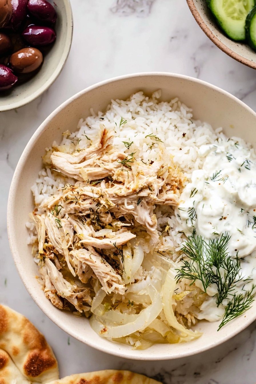 Slow Cooker Greek Chicken, Greek Chicken Dinner, Mediterranean Chicken Recipe, Easy Slow Cooker Chicken, Juicy Greek Chicken - A white bowl on a white marbled surface filled with three main layers: the bottom layer is white rice with a fluffy texture, the middle layer consists of cooked translucent onion slices with light browning, and on top are shredded light beige chicken pieces seasoned with herbs. On one side of the bowl, a dollop of white creamy sauce with green dill leaves is placed. Around the bowl, on the white marbled surface, there is a partial view of a white bowl holding dark purple olives and green cucumber slices, and a woman's hand is holding a piece of light golden flatbread. photo taken with an iphone --ar 2:3 --v 7