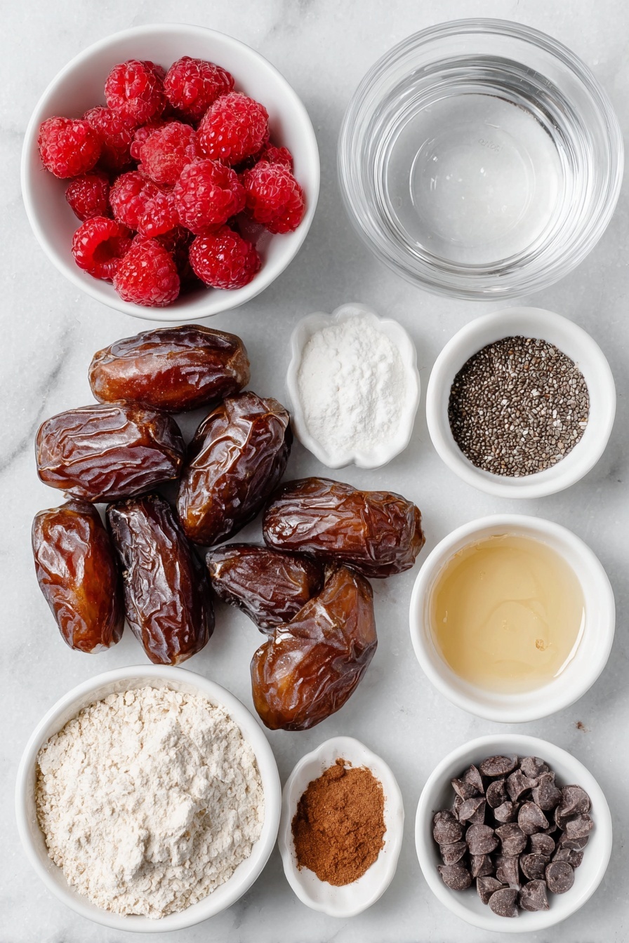Raspberry Brownie Date Bites, healthy raspberry brownie bites, chocolate date bites with raspberry jam, gluten-free raspberry brownie snacks, easy vegan brownie bites - Flat lay of fresh large medjool dates with glossy brown skins, a small white bowl of vibrant frozen raspberries starting to thaw, a few loose chia seeds scattered neatly, a small white bowl filled with clear water, a small white bowl with fine white arrowroot powder, a small pile of rich dark cocoa powder, a small white bowl of amber maple syrup, a small dollop of creamy runny nut butter, a small mound of light oat flour, a small white bowl with pale almond milk, a small white dish holding a tiny amount of golden vanilla extract, a small white bowl filled with smooth dark chocolate chips, and a small white bowl with glossy melted coconut oil, all arranged in perfect symmetry and realistic proportions, placed on a clean white marble surface, soft natural light, photo taken with an iPhone, professional food photography style, fresh ingredients, white ceramic bowls, no bottles, no duplicates, no utensils, no packaging --ar 2:3 --v 7 --p awthu7i m7354615311229779997