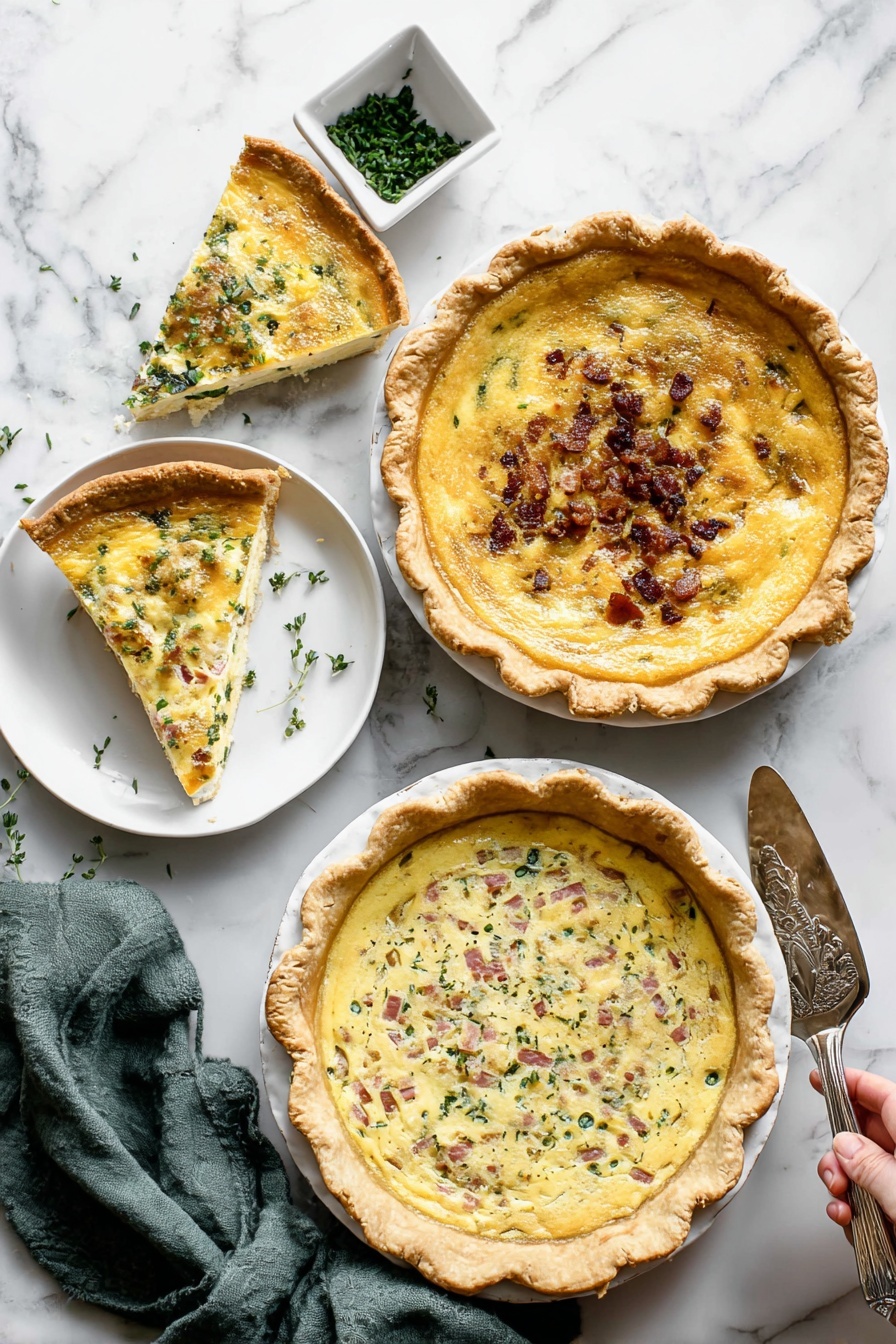 Cheese and Veggie Quiche, delicious breakfast quiche, easy veggie quiche, savory brunch dish, healthy vegetable quiche - The image shows three quiches on a white marbled surface. The top right quiche has a golden yellow smooth filling with a slightly browned top and a thick golden crust; one slice is missing and placed on a small white plate beside it. The middle left quiche has a creamy yellow filling with small green herbs and bits of browned bacon sprinkled on top, with a thick golden crust. The bottom right quiche has a mixed filling of creamy yellow with green leafy vegetables and pink ham chunks scattered inside, topped with melted cheese and a golden crust. Nearby, a white square dish with chopped green herbs and an olive green cloth napkin are visible. A woman's hand holding a silver serving spatula is resting on the surface near the top right quiche. Photo taken with an iphone --ar 2:3 --v 7