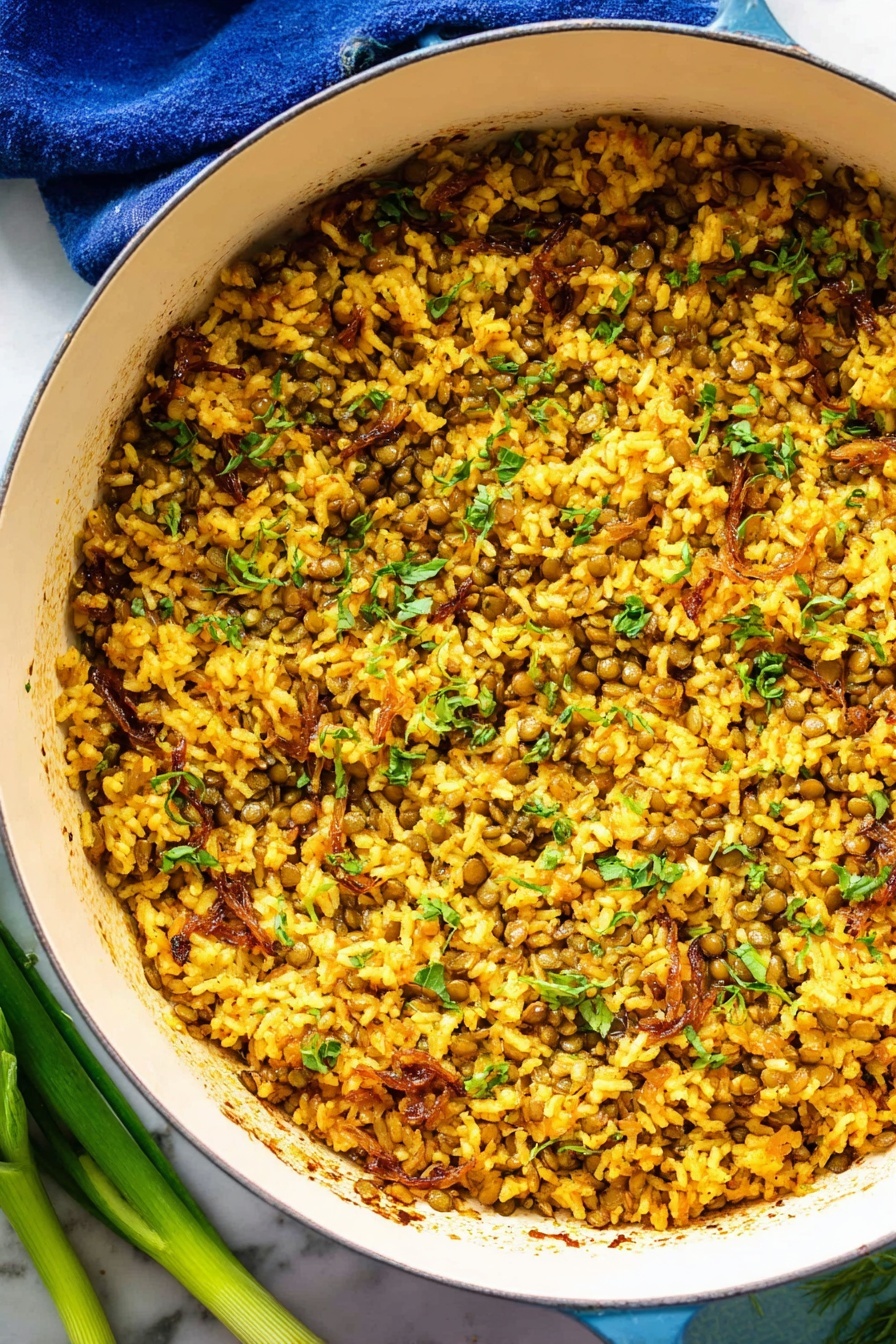 Savory Lentil and Rice Mujadara, Mujadara Middle Eastern dish, How to make Mujadara, Lentil and rice recipes, Hearty vegetarian meals - The image shows a white round pot filled with a mixed dish made of cooked yellow rice and small green lentils, combined with pieces of light brown caramelized onions and chopped green herbs scattered throughout. The texture looks soft and slightly moist with some grains sticking together and a few small charred spots seen inside the pot. The pot is placed on a white marbled surface with a blue cloth partly visible under its handle, and some green onions lay next to the pot on the lower left side. The lighting highlights the warm golden tones of the rice and the fresh green color of the herbs, creating a vibrant and appetizing look. photo taken with an iphone --ar 2:3 --v 7