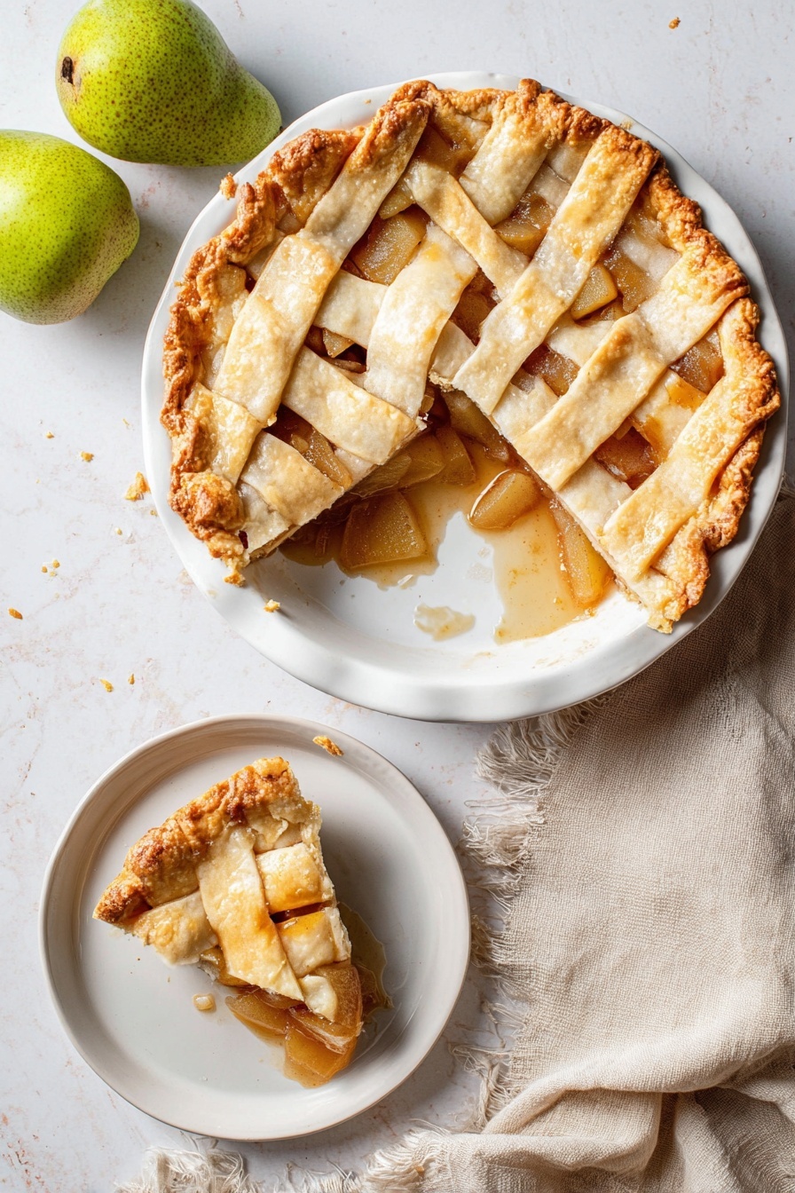Vegan Pear Pie with Chai Spices, vegan pear pie, chai spice dessert, vegan fruit pie, healthy vegan dessert - A round pie with a golden brown lattice crust sits on a white plate, showing a soft, slightly shiny filling of sliced pears and cinnamon sauce underneath. One large slice is missing from the pie, revealing the thick fruit filling and some sauce spilling onto the plate. The crust edges are crimped with a slightly darker golden tone. Next to the pie is a smaller white dish with a single slice of the pie, showing the same layers clearly. The scene is on a white marbled surface, with two whole green pears in the top left corner and a soft beige cloth napkin with frayed edges near the bottom left. photo taken with an iphone --ar 2:3 --v 7