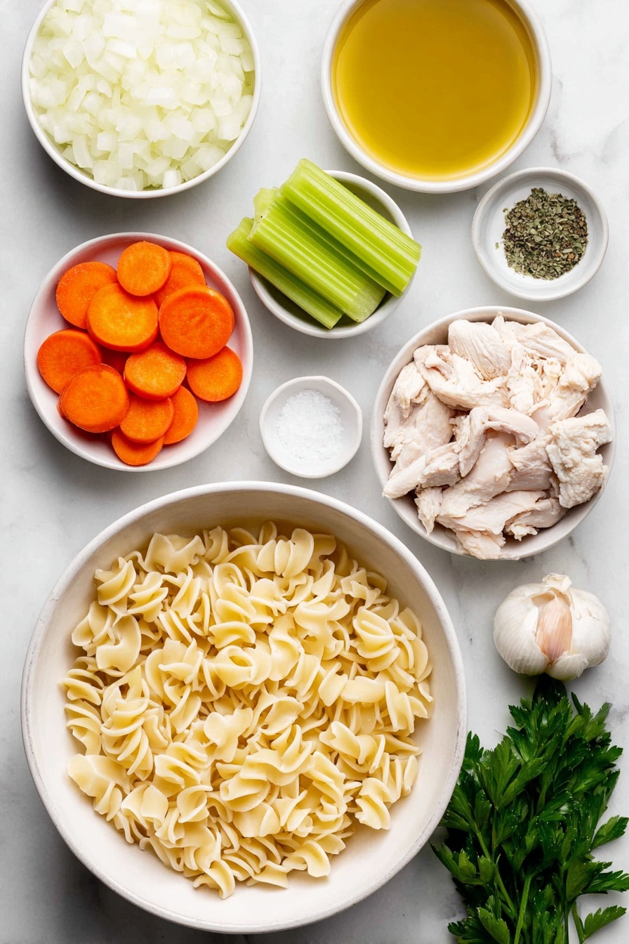 Vegan Chicken Noodle Soup, vegan soup recipe, plant-based chicken noodle soup, healthy vegan soup, comforting vegan noodle soup - Flat lay of a small white ceramic bowl of golden olive oil, a large white ceramic bowl filled with chopped white onion, a few cloves of whole unpeeled garlic, three bright green celery stalks sliced, three peeled and sliced vibrant orange carrots, a small white ceramic bowl of dried green basil, a small white ceramic bowl of dried thyme, chopped vegan chicken pieces resembling small beige chunks, uncooked gigli pasta with its twisted funnel shape arranged neatly, a small white ceramic bowl of coarse salt crystals, a small white ceramic bowl of cracked black peppercorns, and a small bunch of fresh green parsley sprigs, all placed on a clean white marble surface, soft natural light, photo taken with an iPhone, professional food photography style, fresh ingredients, white ceramic bowls, no bottles, no duplicates, no utensils, no packaging --ar 2:3 --v 7 --p m7354615311229779997
