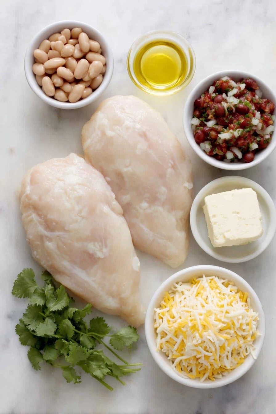 Salsa Chicken Bake, Mexican chicken casserole, easy dinner recipes, cheesy chicken bake, flavorful chicken dinner - Flat lay of two large raw boneless skinless chicken breasts, a small white bowl of orange-red taco seasoning powder, a small white bowl of golden olive oil, a block of creamy white cream cheese, a small white bowl filled with smooth light brown refried beans, a small white bowl of chunky red salsa with visible tomato and herbs, a small white bowl with shredded pale yellow cheddar cheese, a small white bowl with shredded white Monterey Jack cheese, and a few fresh bright green cilantro sprigs arranged neatly — all placed on a clean white marble surface, soft natural light, photo taken with an iPhone, professional food photography style, fresh ingredients, white ceramic bowls, no bottles, no duplicates, no utensils, no packaging --ar 2:3 --v 7 --p m7354615311229779997