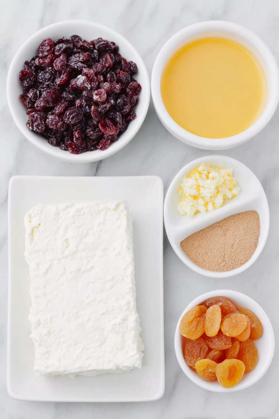 Cranberry Cream Cheese Spread, holiday appetizer, festive cheese spread, easy fruit cheese dip, cranberry cheese appetizer - Flat lay of a block of fresh cream cheese on a simple white ceramic plate, a small white bowl filled with bright red chopped dried cranberries, a small white bowl with vibrant orange chopped dried apricots, another small white bowl containing fresh orange juice, a small white bowl with finely grated orange zest, and a tiny white bowl holding ground ginger powder, all arranged in perfect symmetry, placed on a clean white marble surface, soft natural light, photo taken with an iPhone, professional food photography style, fresh ingredients, white ceramic bowls, no bottles, no duplicates, no utensils, no packaging --ar 2:3 --v 7 --p m7354615311229779997