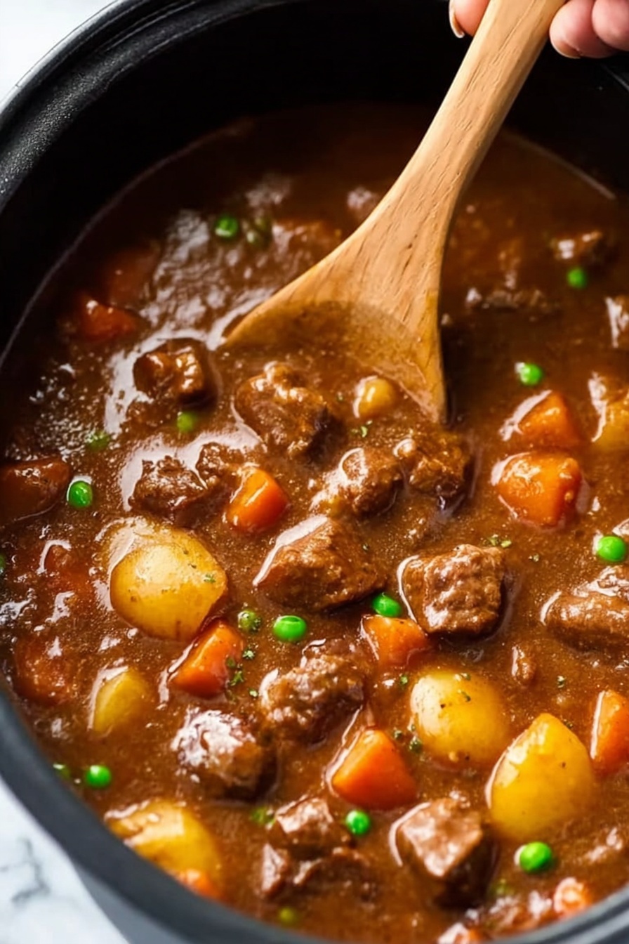 Slow Cooker Beef Stew with Red Wine, hearty beef stew, slow cooker beef recipes, red wine beef stew, comforting winter dinner - A close-up view of a black pot filled with thick brown stew that has a shiny, smooth surface. Inside the stew, there are many chunks of tender-looking brown meat scattered throughout. Bright orange carrot pieces, small round yellow potatoes, and green peas are mixed evenly in the stew, adding color contrast. A woman's hand is holding a wooden spoon stirring the stew, lifting some pieces of meat and vegetables above the surface. The background is a white marbled texture. Photo taken with an iphone --ar 2:3 --v 7