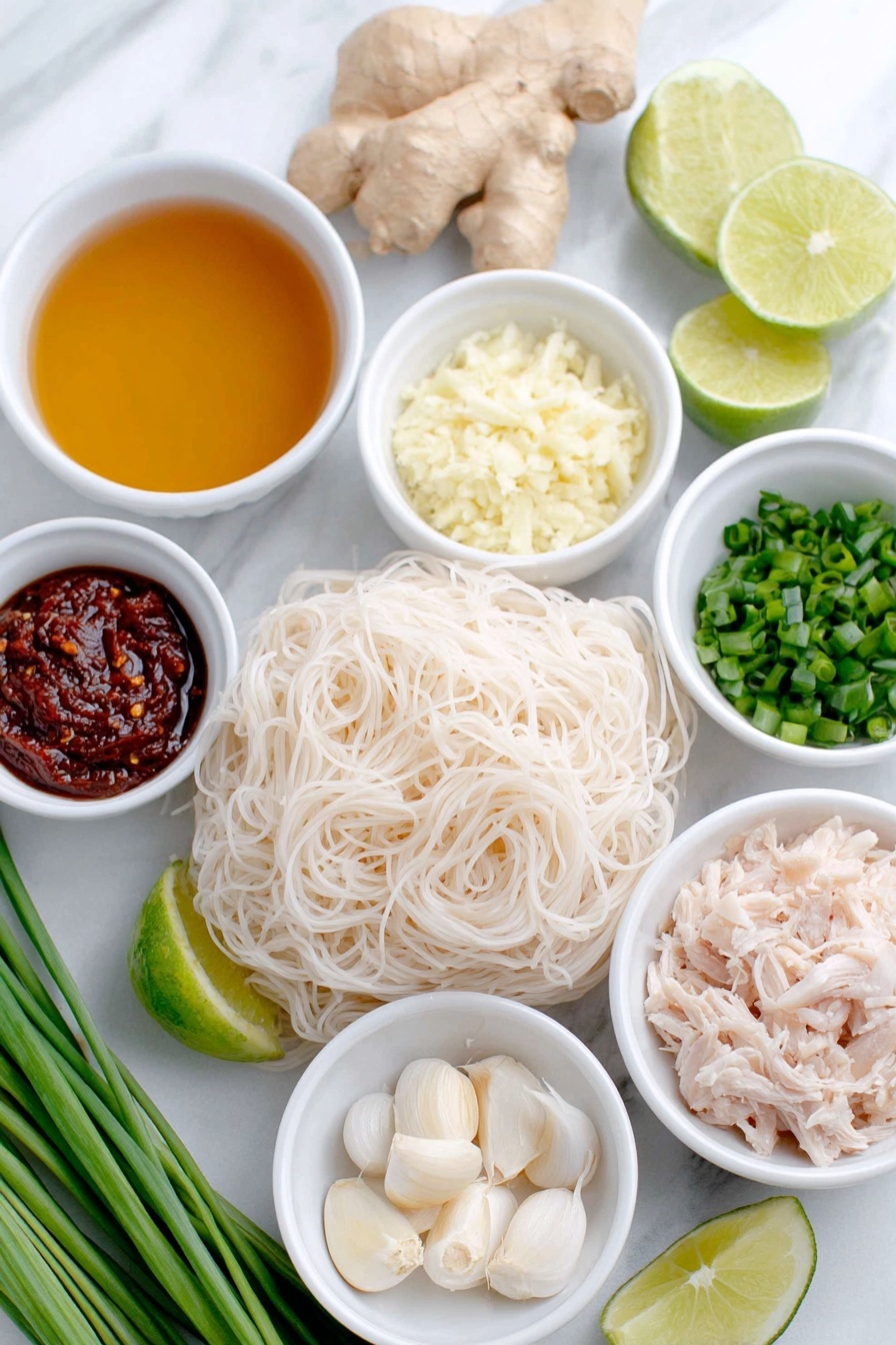 Thai Chicken Curry Soup, Thai Chicken Curry, Easy Thai Soup, Coconut Curry Soup, Spicy Thai Soup - Flat lay of a small white ceramic bowl of golden olive oil, a small white ceramic bowl with finely chopped pale yellow onion, a small white ceramic bowl holding grated fresh ginger with light beige fibrous texture, three whole uncracked garlic cloves with smooth white skins, a small white ceramic bowl filled with vibrant deep red Thai curry paste, a small white ceramic bowl of clear chicken broth with a warm amber tint, a small white ceramic bowl with fresh pale green lime juice, an uncooked bundle of thick 3mm rice noodles with delicate white translucent strands, a small white ceramic bowl of creamy white coconut milk, a small white ceramic bowl with shredded cooked chicken showing tender white and light brown pieces, a small pile of fresh bright green torn basil leaves, a small pile of chopped fresh vibrant green cilantro, a small pile of chopped fresh green scallions, and a few wedges of fresh lime with bright green rind and pale juicy flesh arranged in perfect symmetry, all placed on a clean white marble surface, soft natural light, photo taken with an iPhone, professional food photography style, fresh ingredients, white ceramic bowls, no bottles, no duplicates, no utensils, no packaging --ar 2:3 --v 7 --p m7354615311229779997