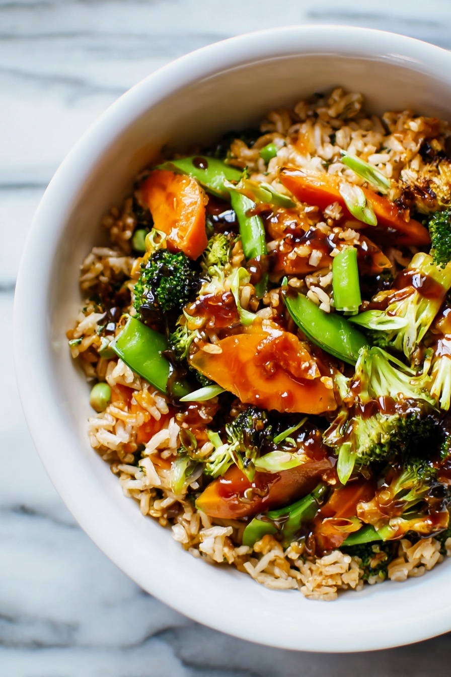 Teriyaki Chicken Casserole, easy chicken casserole, healthy chicken bake, weeknight dinner ideas, savory casserole recipes - The image shows a white bowl filled with a colorful stir-fry dish on a white marbled surface. The dish has three main layers: at the bottom, there is a layer of cooked rice with a light brown color and fluffy texture. The middle layer contains a mix of bright orange baby carrots, green snap peas, and small broccoli florets, giving the dish a fresh and vibrant look. The top layer is a light drizzle of dark brown sauce covering parts of the rice and vegetables, adding a shiny finish. The overall look is warm and inviting, with a mix of soft and crisp textures visible. Photo taken with an iphone --ar 2:3 --v 7